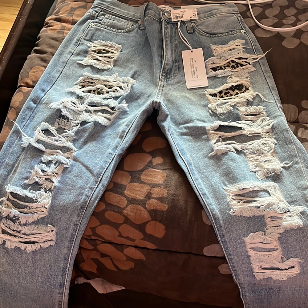 Just black brand. Size 25 frayed jeans. Light denim leopard pattern in areas
